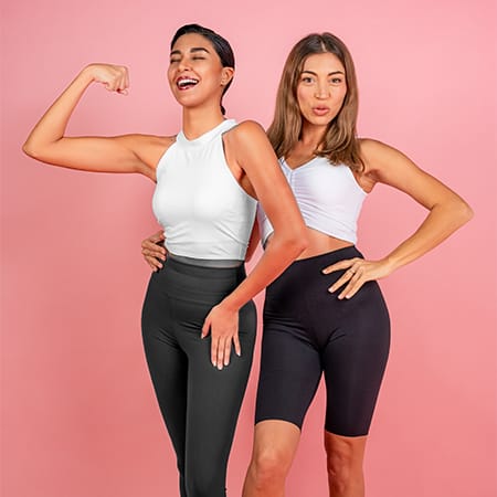 2 ladies standing side by side.